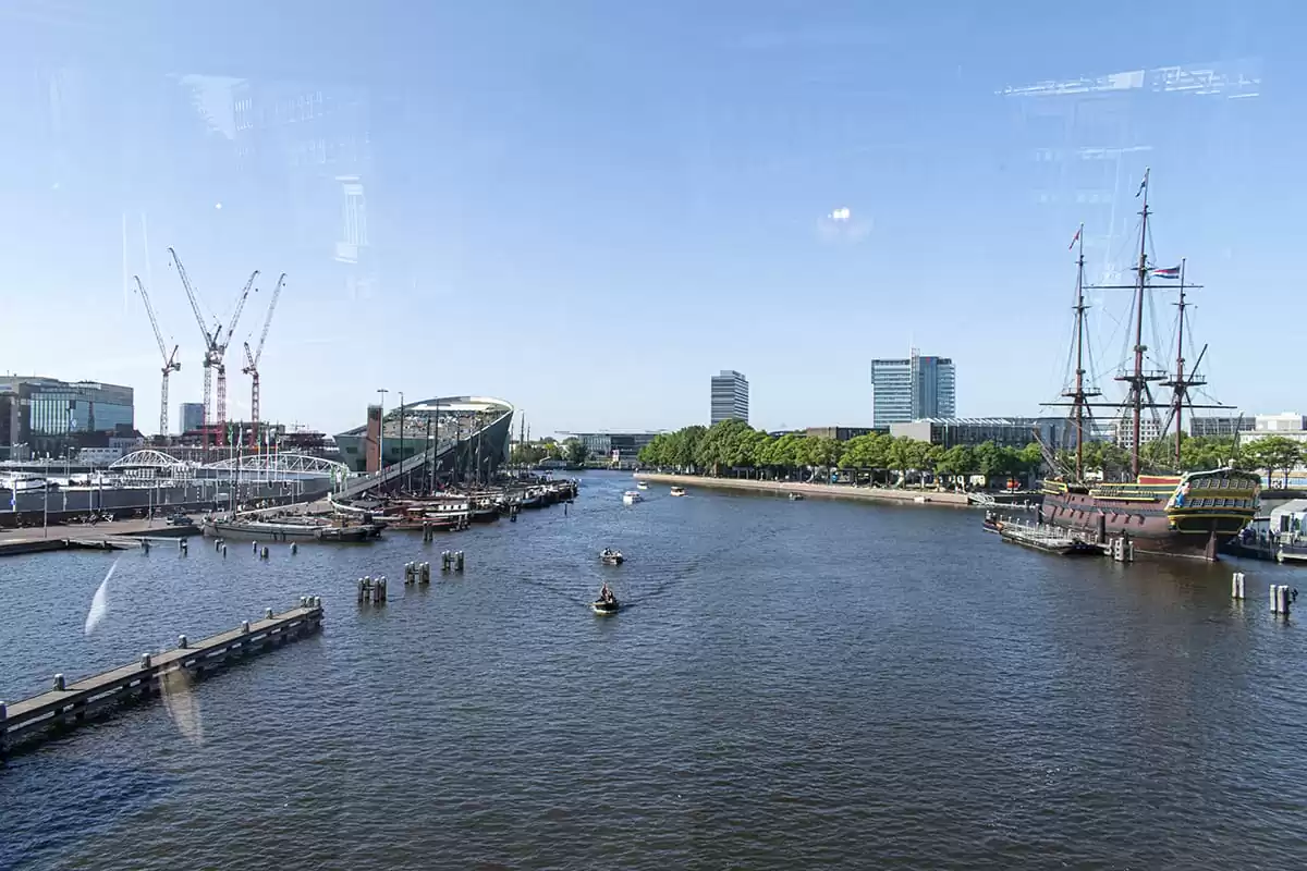 Photo of SWEETS hotel Amsterdam Center bridge house Kortjewantsbrug water canal view of nemo science museum and voc ship de amsterdam