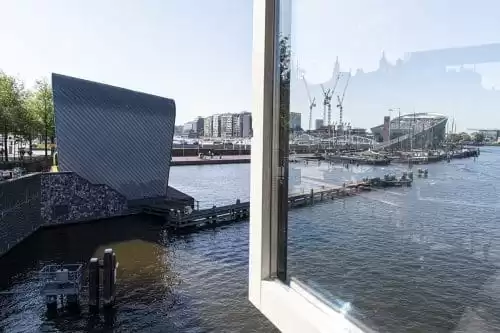 Photo of SWEETS hotel Amsterdam Center bridge house Kortjewantsbrug water view from kitchen arcam architecture centre nemo science museum
