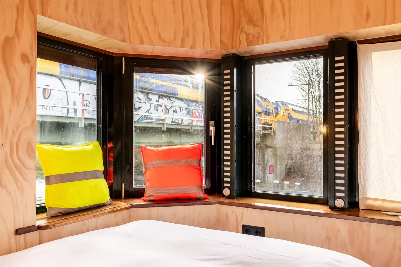 Windows, windowsill and view of SWEETS hotel's bridge house Omvalbrug