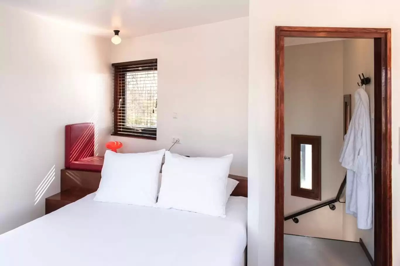 SWEETS hotel Amsterdam Noord Holland_bridge house 104 IJdoornlaanbrug_hotel interior_bedroom seating bathrobes