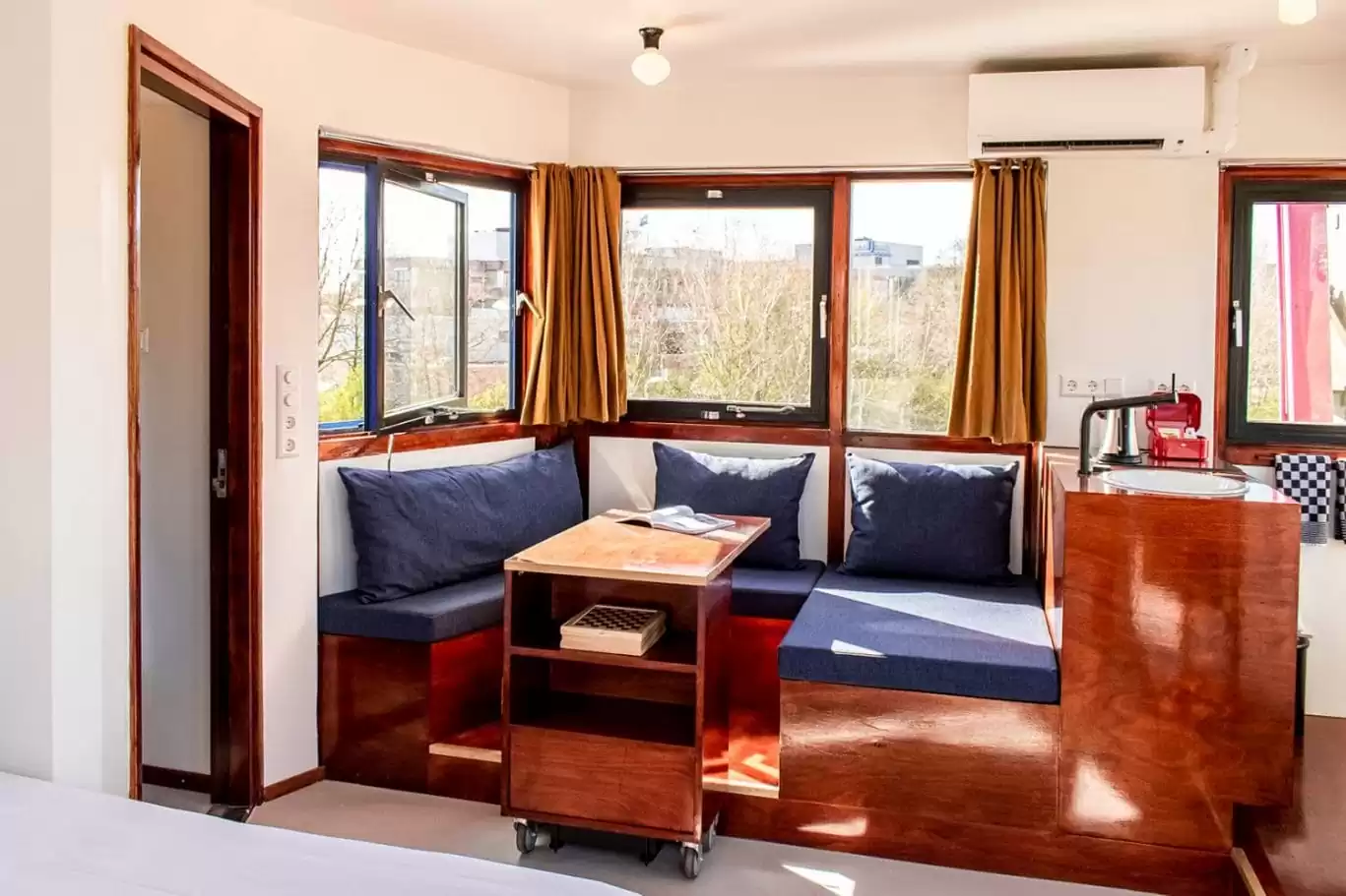 Interior of SWEETS hotel Amsterdam's IJdoornlaanbrug bridge house with a seating area