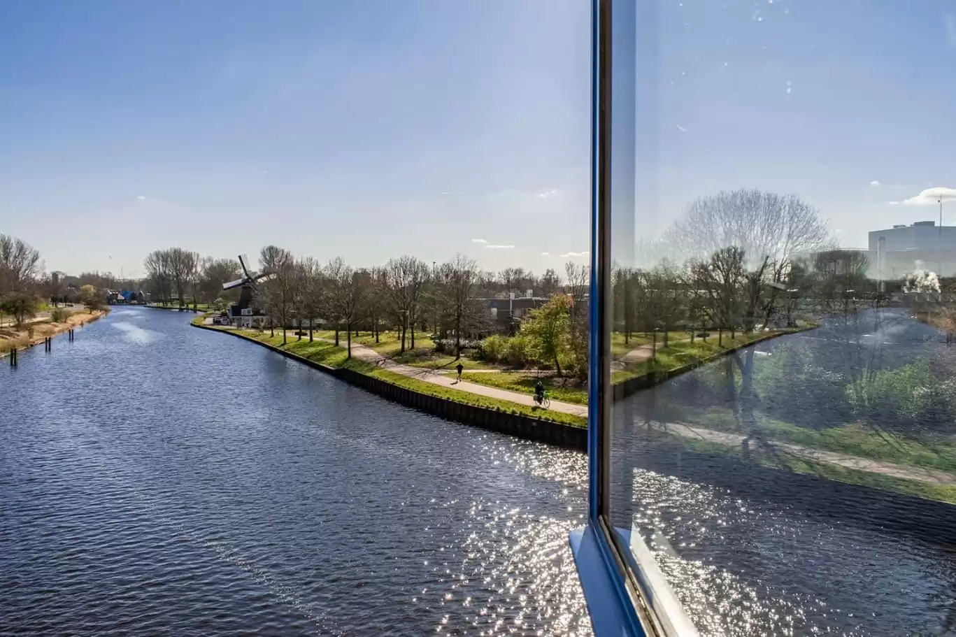 SWEETS hotel Amsterdam Noord Holland_bridge house 104 IJdoornlaanbrug_hotel interior_view of dutch windmill from hotel room