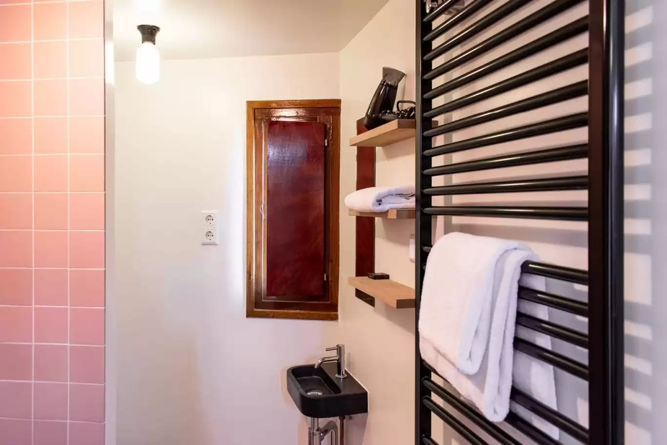 Bathroom of SWEETS hotel Amsterdam's IJdoornlaanbrug; towels and a hairdryer are supplied