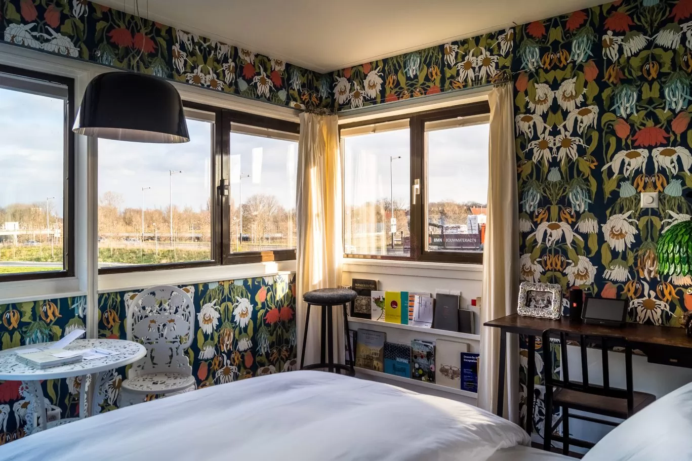 SWEETS hotel Amsterdam Noord_bridge house 102 Meeuwenpleinbrug_bedroom interior design by Studio Job_wallpaper table chair lamp_hotel view