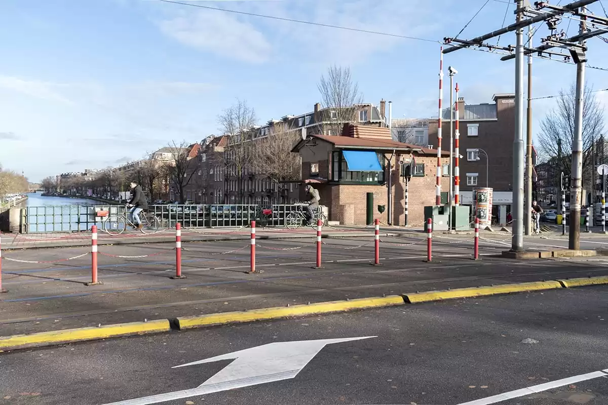 Photo of SWEETS hotel Amsterdam West Overtoomsesluis bridge house exterior cyclists