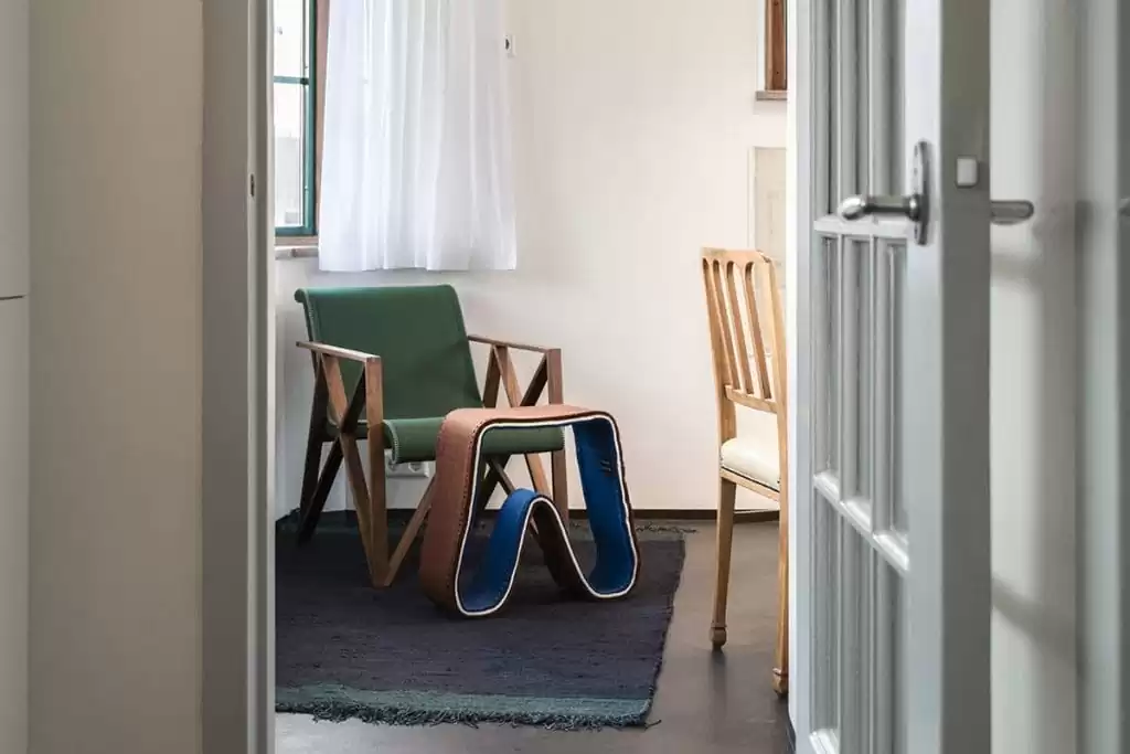 Photo of SWEETS hotel Amsterdam West Overtoomsesluis bridge house interior living room chair rug