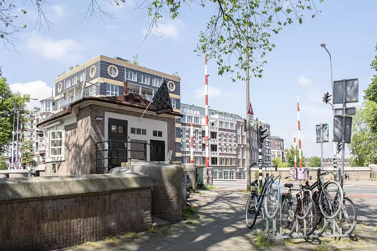 Photo of SWEETS hotel Amsterdam West Van Hallbrug bridge house exterior hotel near Amsterdam Center entrance door neighbourhood bicycles