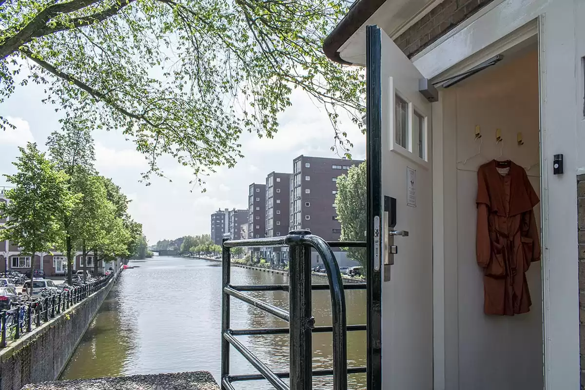 Photo of SWEETS hotel Amsterdam West Van Hallbrug bridge house exterior hotel near Amsterdam Center entrance door canal view