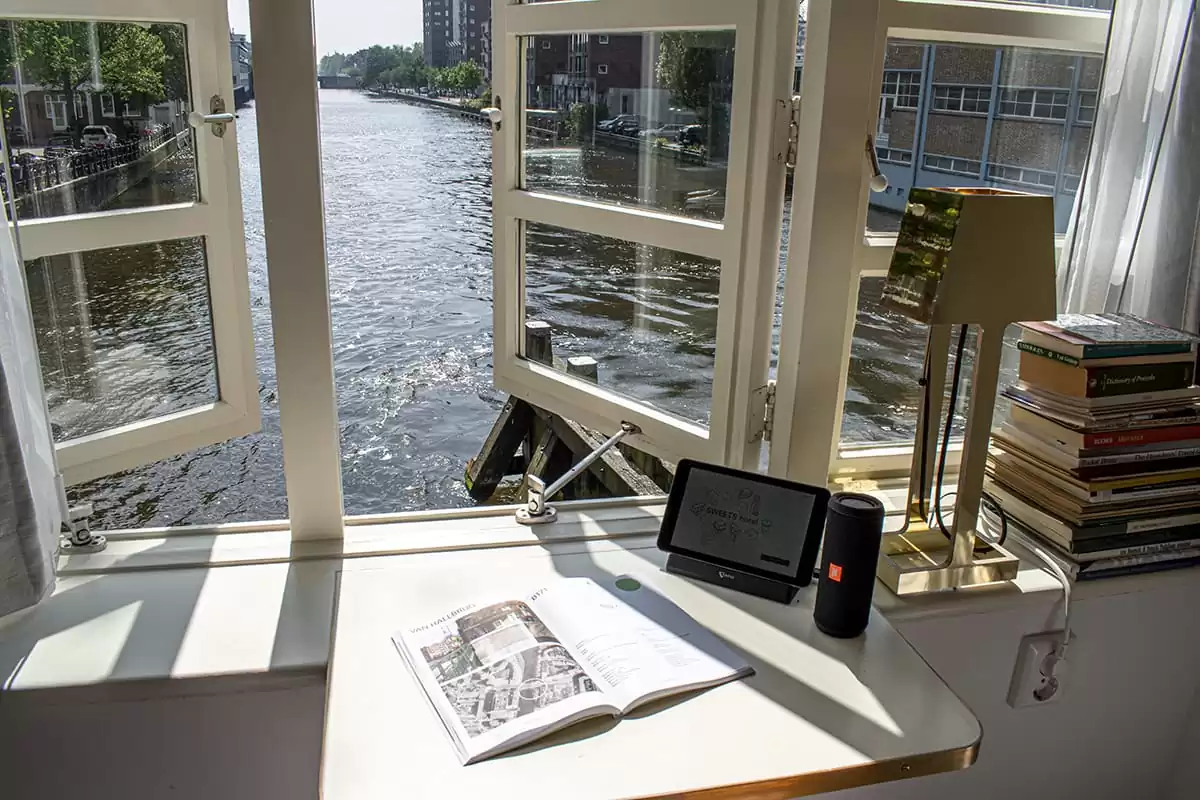 Photo of SWEETS hotel Amsterdam West Van Hallbrug bridge house interior hotel near Amsterdam Center water canal river view view from bedroom suitepad