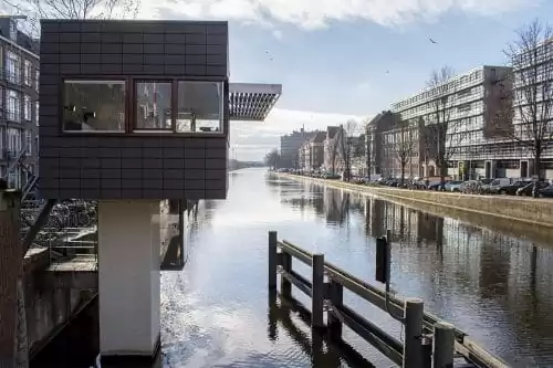Photo of SWEETS hotel Amsterdam West Zeilstraatbrug bridge house exterior neighborhood canal view