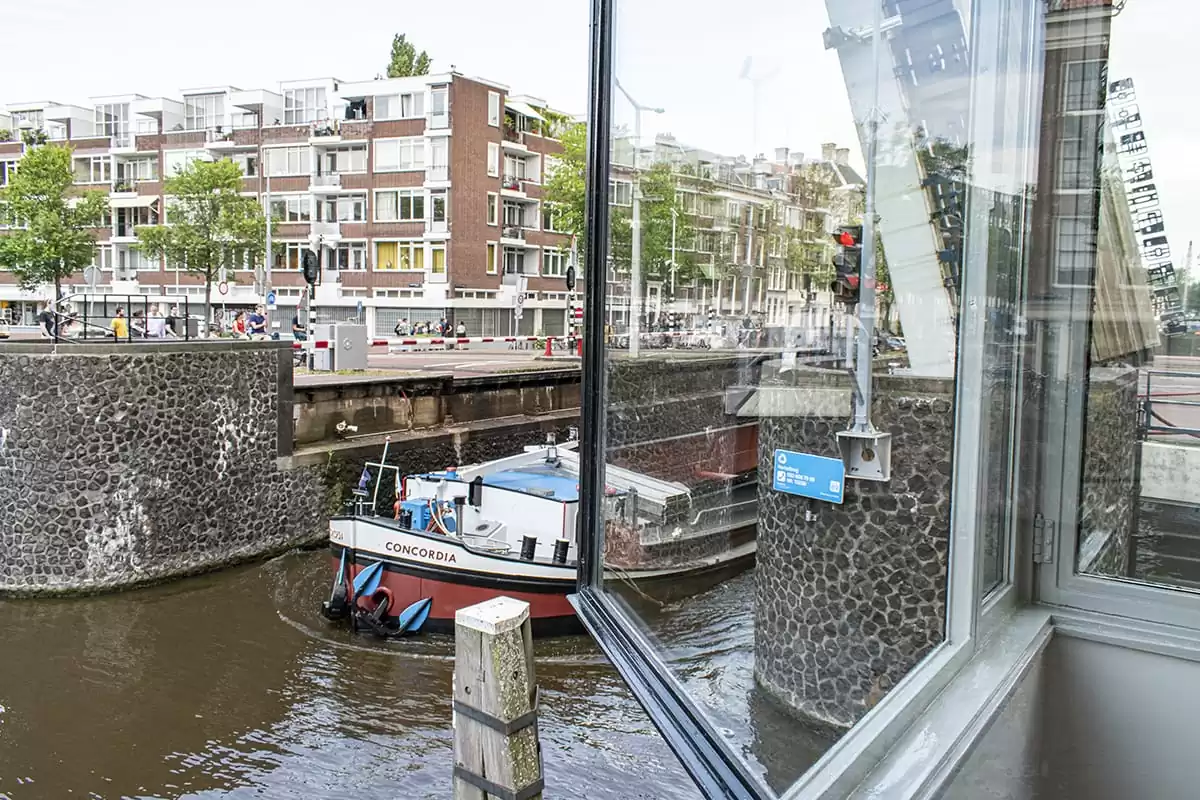 Photo of SWEETS hotel Amsterdam bridge house Hortusbrug hotel near Amsterdam Center nearby Hortus Botanicus canal view bridge opening