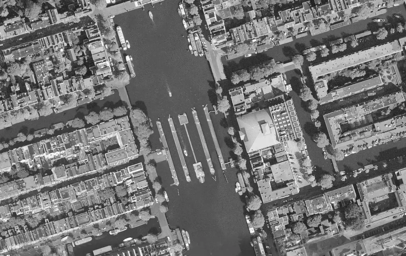 SWEETS hotel Amstelschutsluis bridge house on Amsterdam canals - history photo with view on Amstel and Carré - SWEETS Hotel Amsterdam