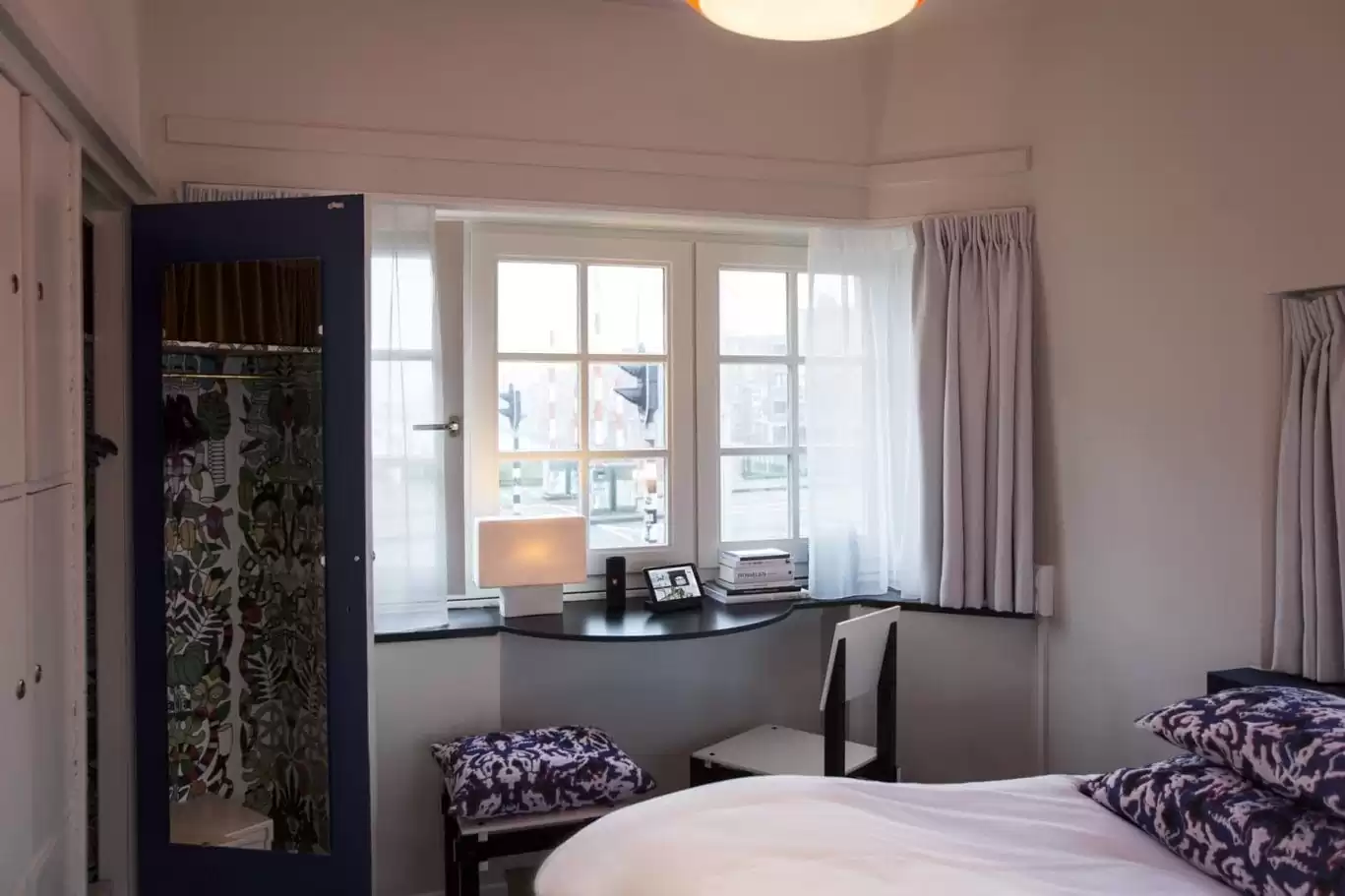 SWEETS hotel Beltbrug bridge house on Amsterdam canals next to windmill - design interior with Roos Soetekouw pillows and Rietveld chair