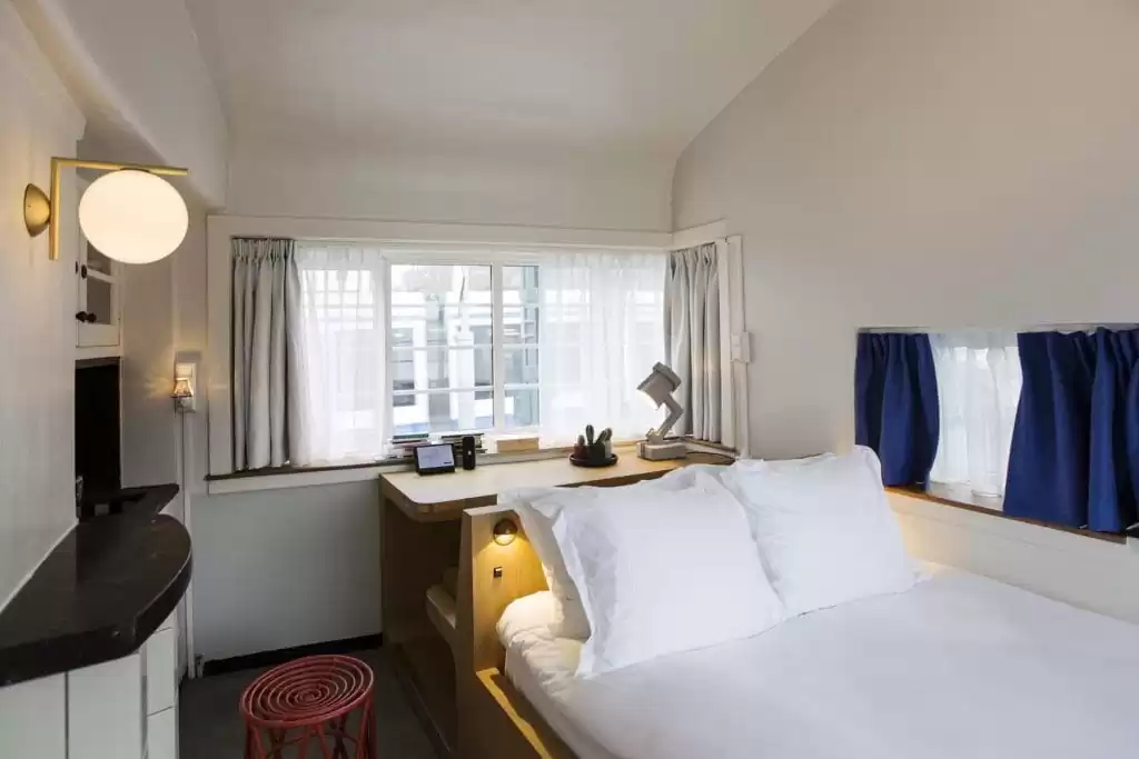 SWEETS hotel Kinkerbrug bridge house on Amsterdam canals - design interior with wooden desk close to Kinkerstraat and Ten Kate markt