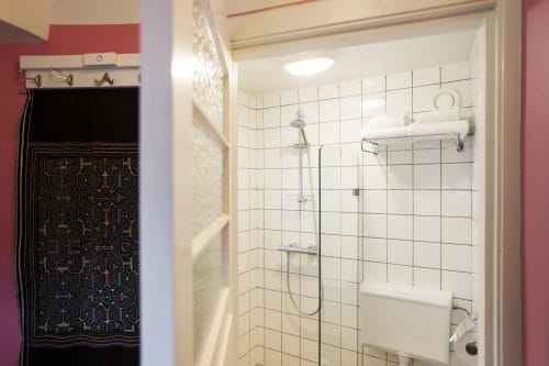 SWEETS hotel Kinkerbrug bridge house on Amsterdam canals - white bathroom with toilet and shower close to Kinkerstraat and Ten Kate markt