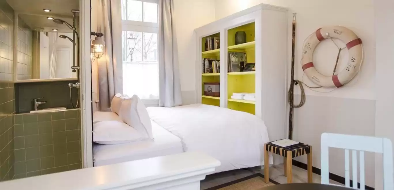 SWEETS hotel Scharrebiersluis bridge house on Amsterdam canals - monumental closet with Gispen design interior