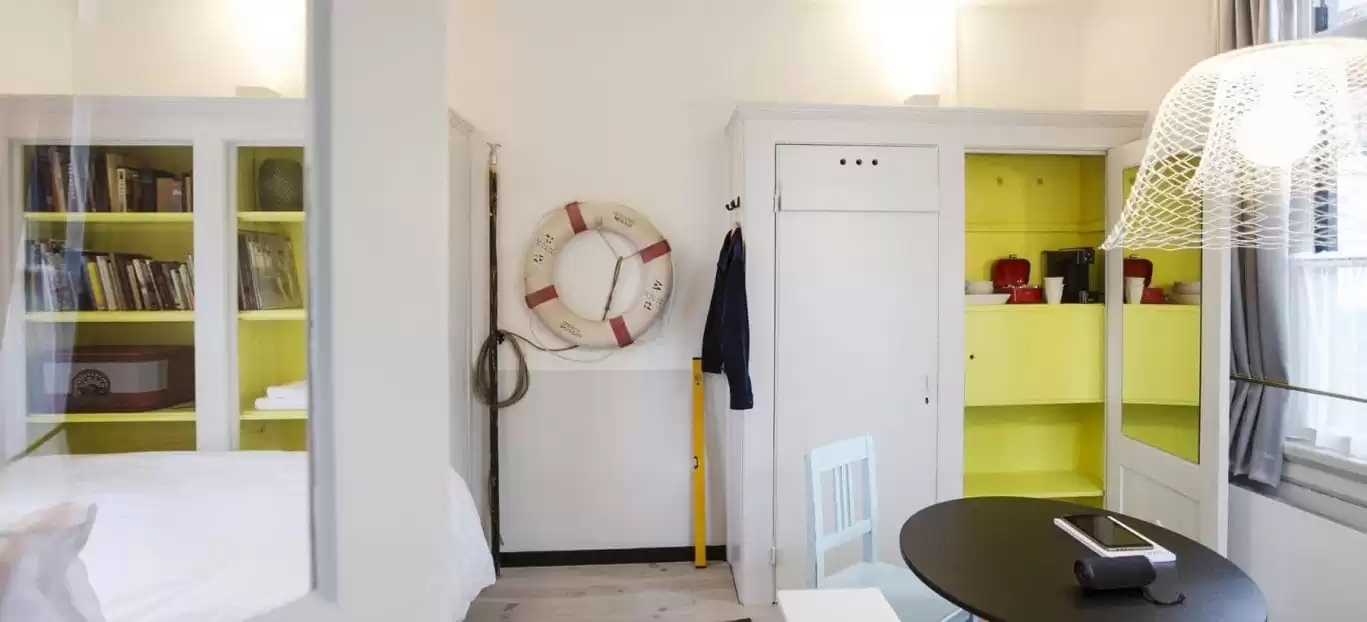 SWEETS hotel Scharrebiersluis bridge house on Amsterdam canals - monumental closet with Gispen design interior