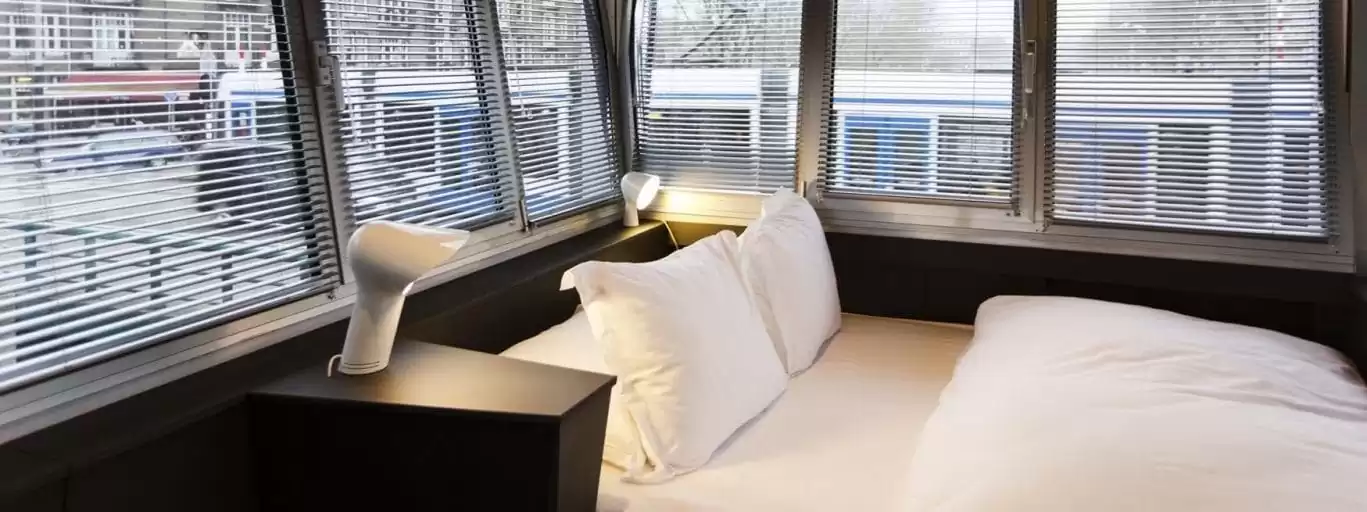 SWEETS hotel Wiegbrug bridge house on Amsterdam canals - design interior with Sorella lamp